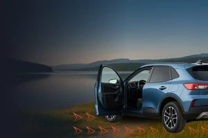 Car sitting by a lake