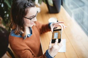 mobile-deposit-checking-closeup-woman