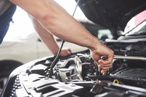 hand_working_on_engine_mobile